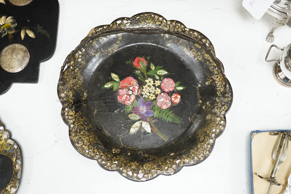 A collection of Victorian papier maché to include an inkstand, a pair of Victorian mirrored wall brackets and a swing handled dish, largest 30cm high
